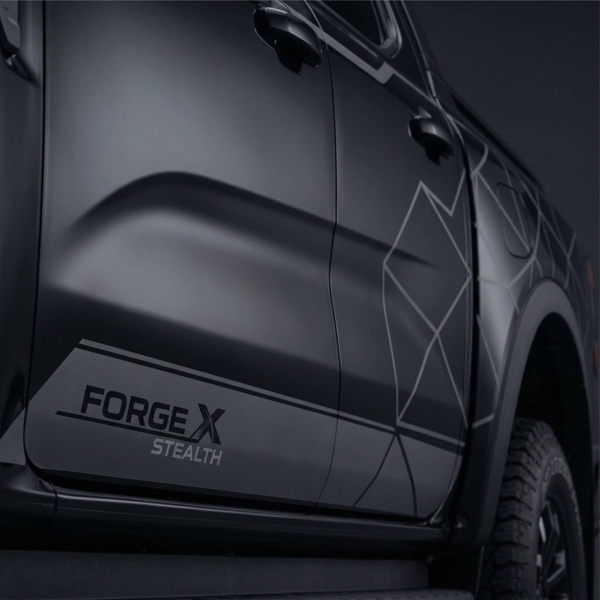 Dark pickup with stealth lower door graphics